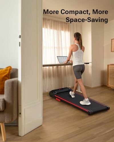 Woman using a compact treadmill at home under a desk